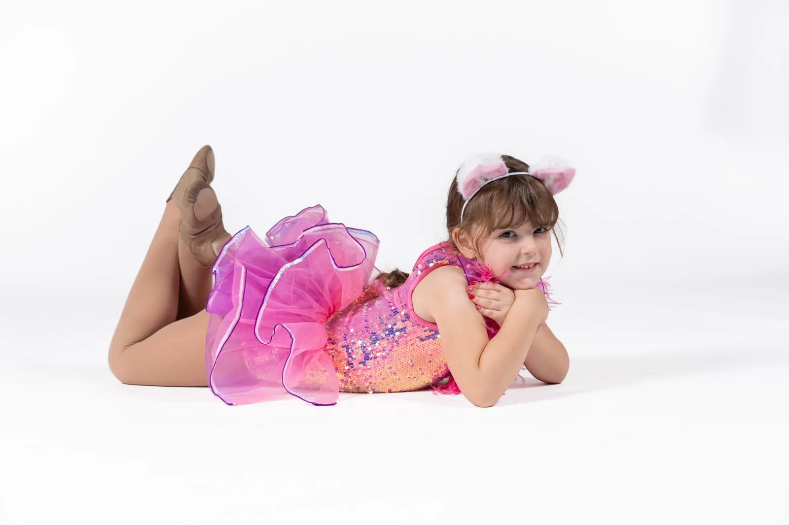Young dancer in a bright pink costume